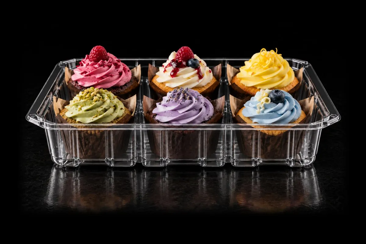 Baked goods in a clear Lucid tray on black