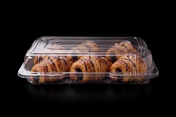 Baked goods in a clear Lucid tray on black