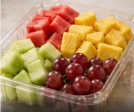 Cubes of fresh cut fruit in a clear Lucid Infinity tray