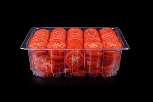 Prepared food in a clear Lucid tray on black