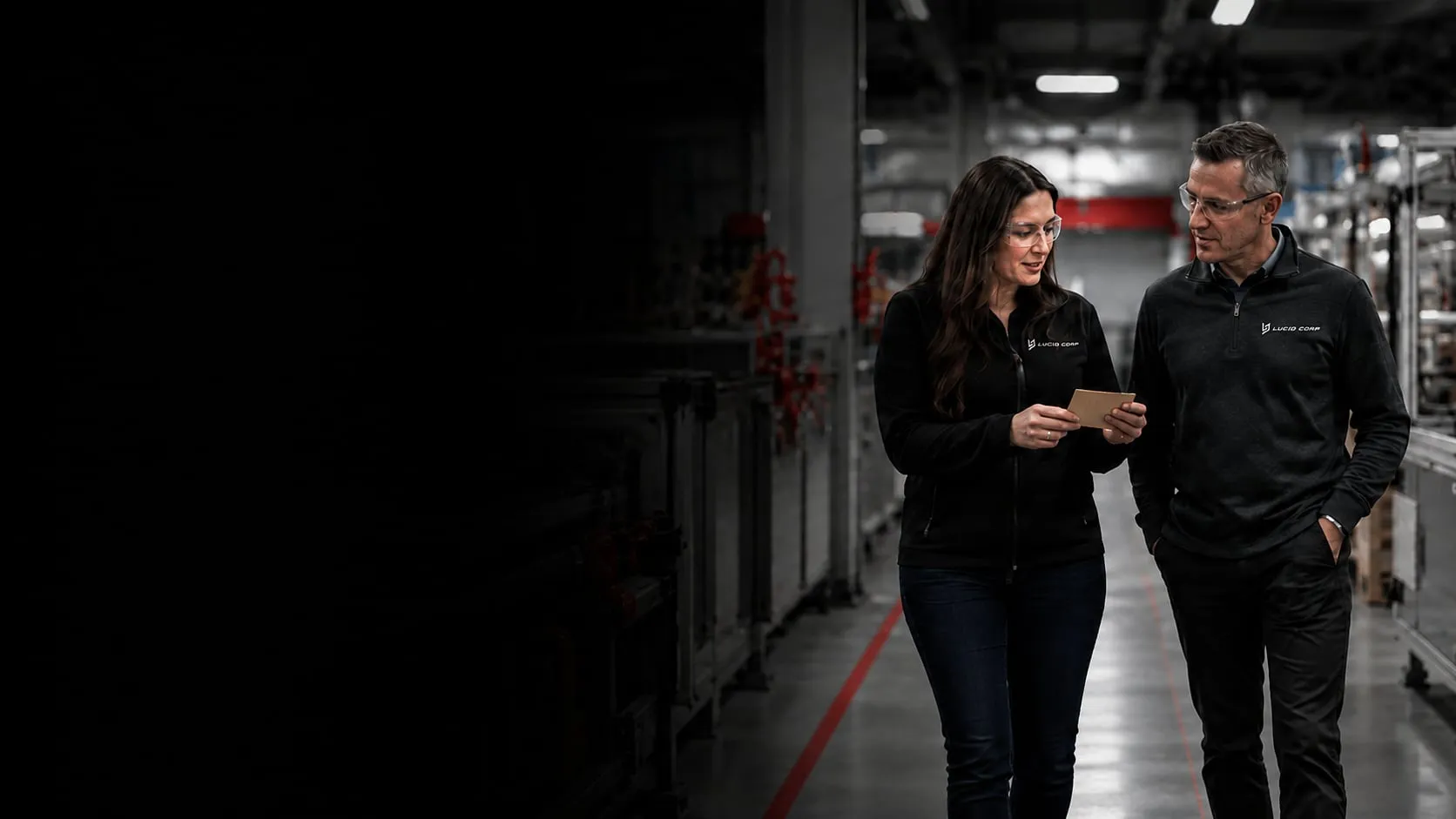 Lucid team members walking the plant floor between forming lines