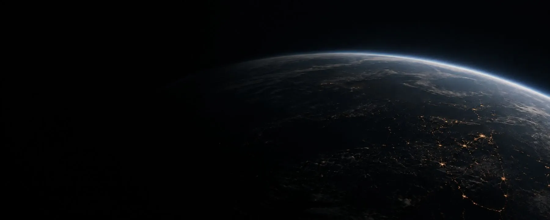 The Earth seen from space, oceans and cloud cover against black