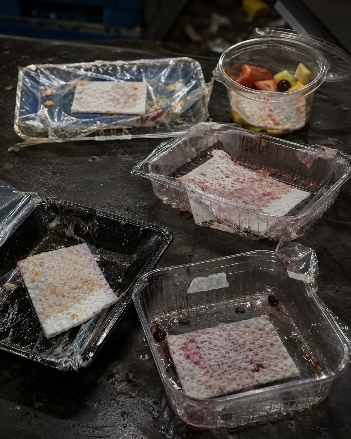 Berries, meat and seafood side by side in padded retail packs